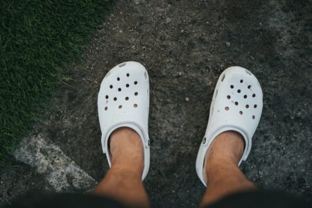 person wearing white rubber clog crocs