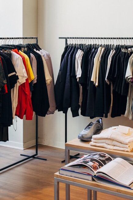 assorted-color clothes hanging on metal racks